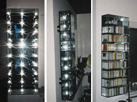 Glasvitrine mit Spiegelr&uuml;ckwand und Aufh&auml;ngung in Edelstahl mit UV-Verklebung