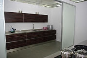 Designerküche von Eggersmann: Edelholz Makassar / Edelstahl