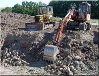 Planierraupe und Radbagger