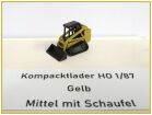 Kompacktlader Gelb mittel mit Schaufel