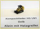 Kompacktlader Gelb klein mit Holzgreifer