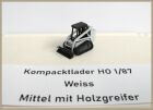 Kompacktlader Weiss mittel mit Holzgreifer